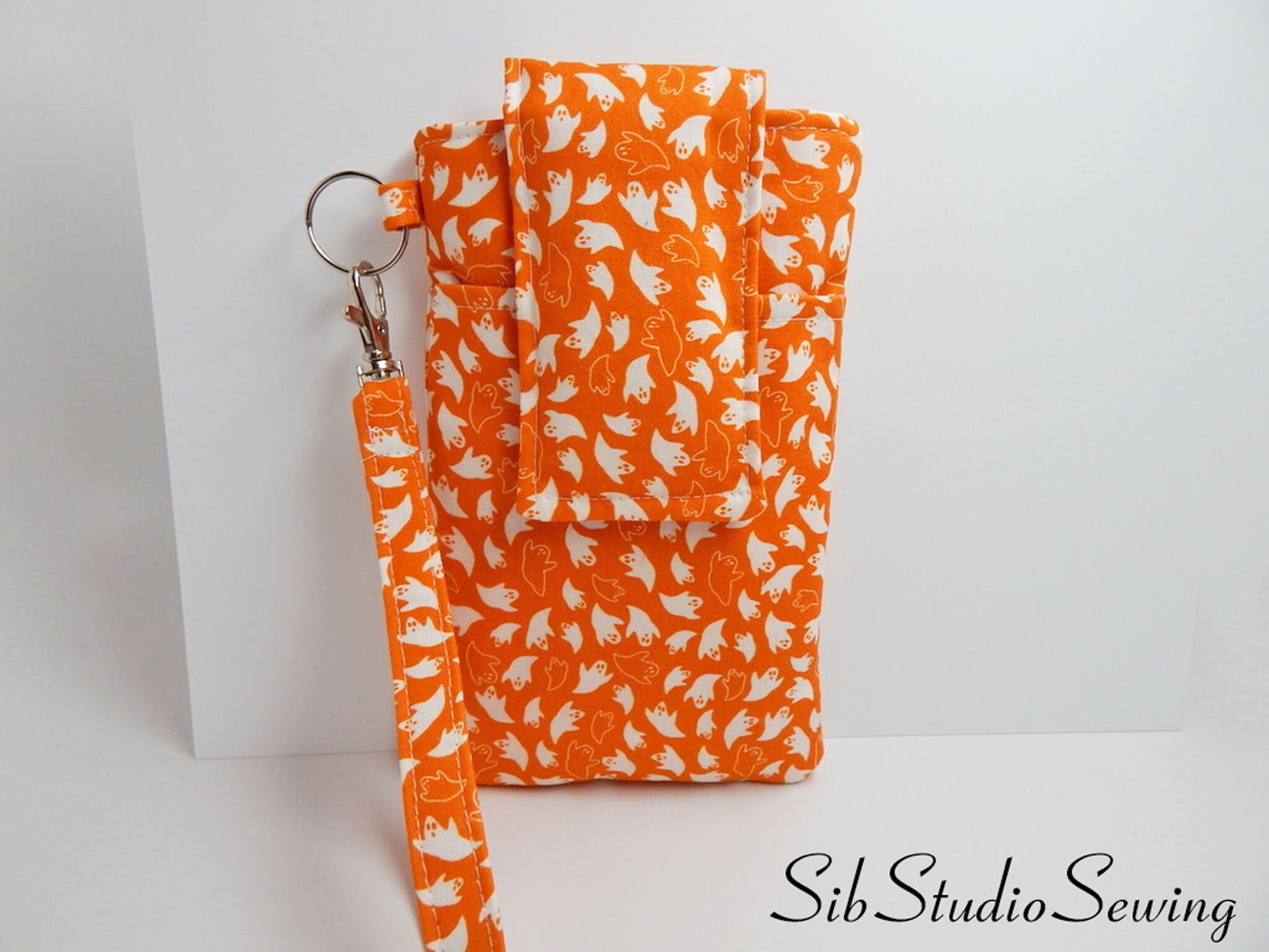 Ghosts Phone Wristlet: Halloween Smartphone Holder with Key Ring, Fits iPhone 16, Phones up to 6.5", Pocket