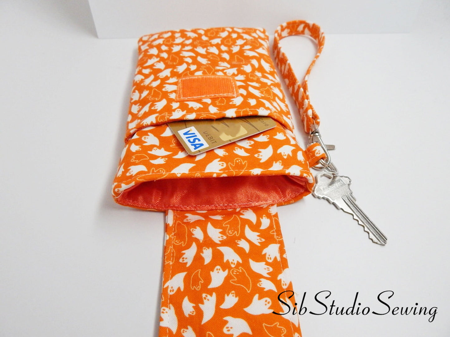 Ghosts Phone Wristlet: Halloween Smartphone Holder with Key Ring, Fits iPhone 16, Phones up to 6.5", Pocket