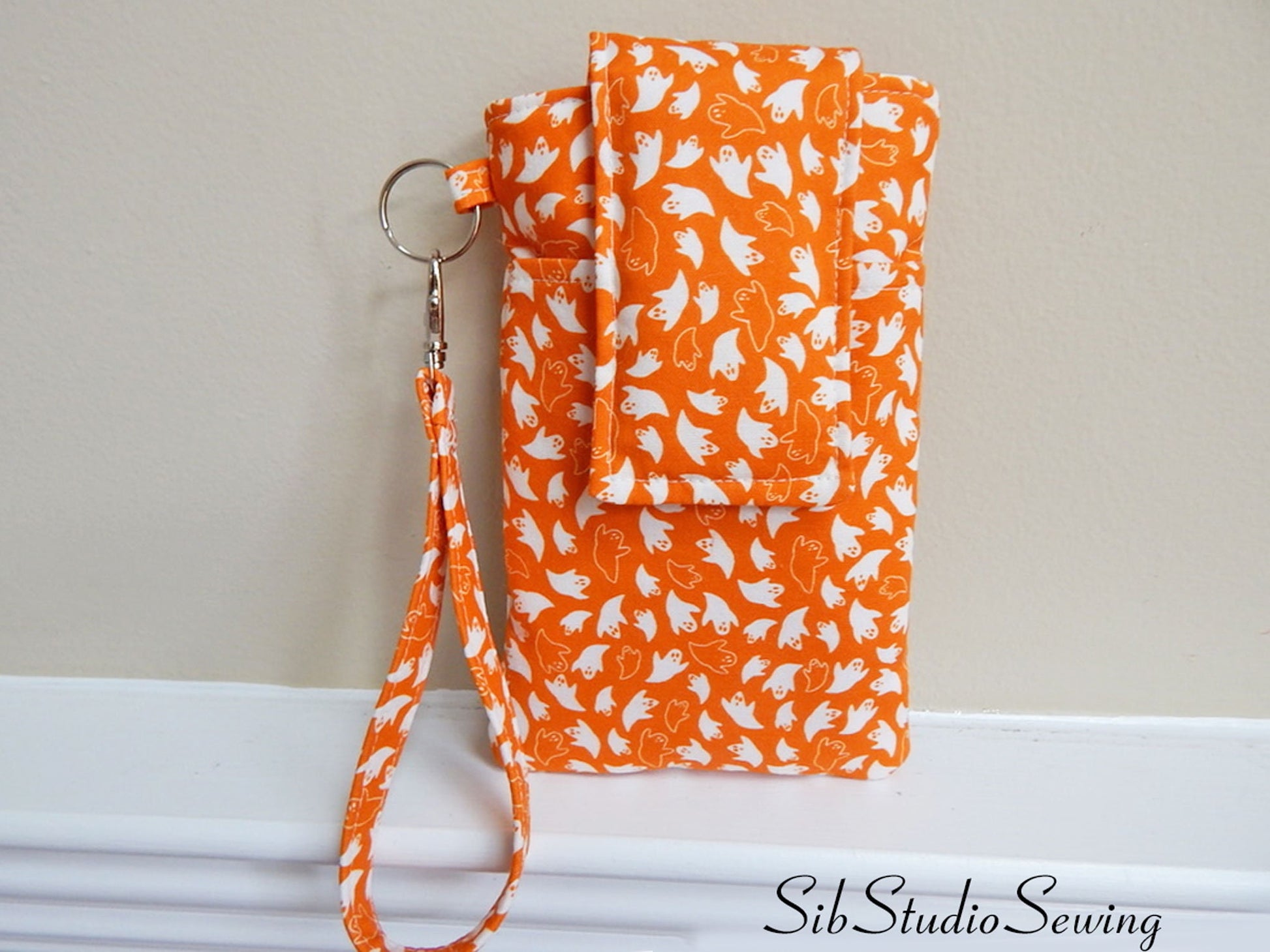 Ghosts Phone Wristlet: Halloween Smartphone Holder with Key Ring, Fits iPhone 16, Phones up to 6.5", Pocket