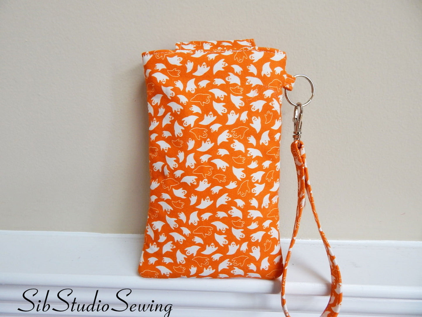 Ghosts Phone Wristlet: Halloween Smartphone Holder with Key Ring, Fits iPhone 16, Phones up to 6.5", Pocket