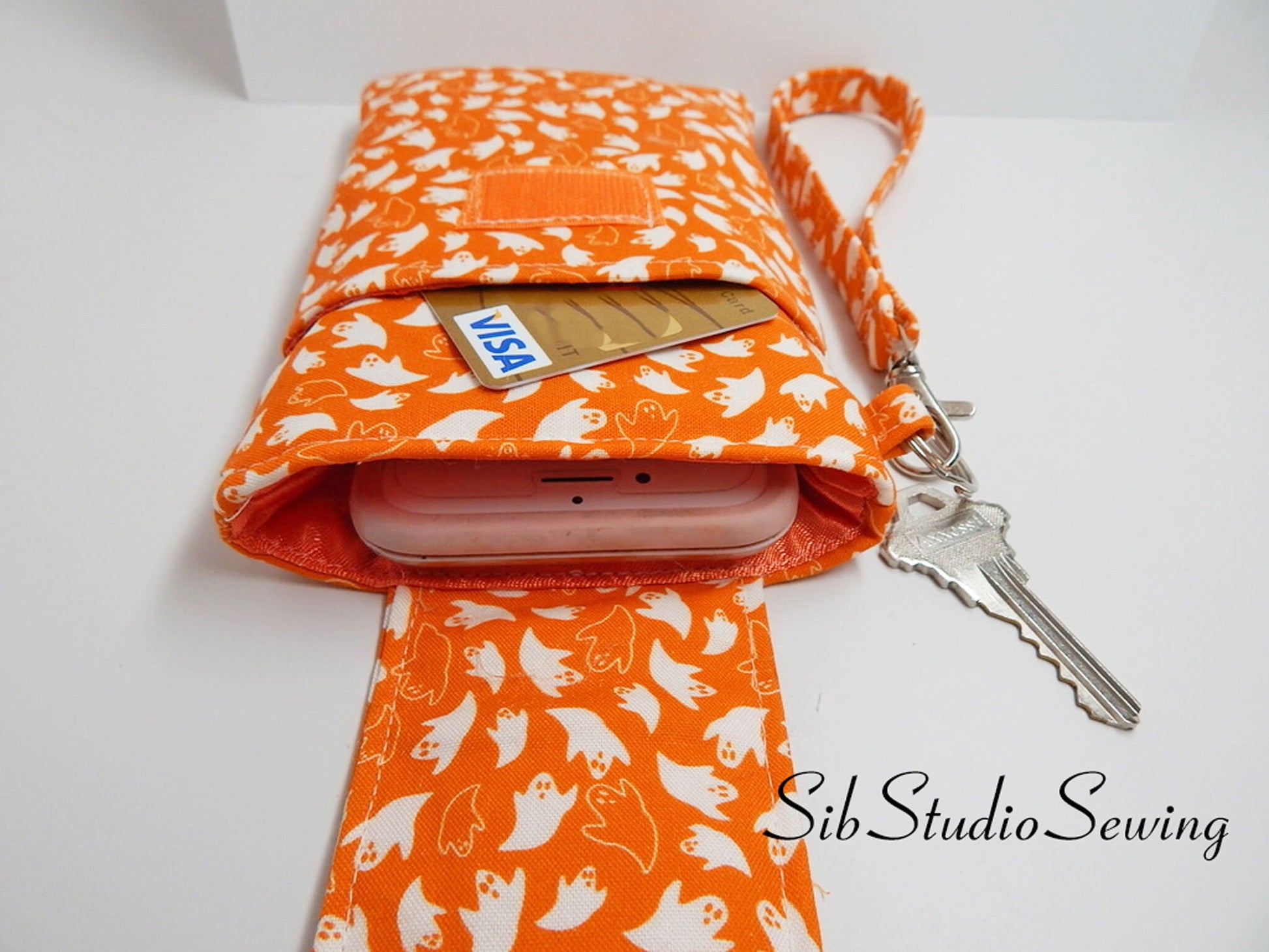 Ghosts Phone Wristlet: Halloween Smartphone Holder with Key Ring, Fits iPhone 16, Phones up to 6.5", Pocket