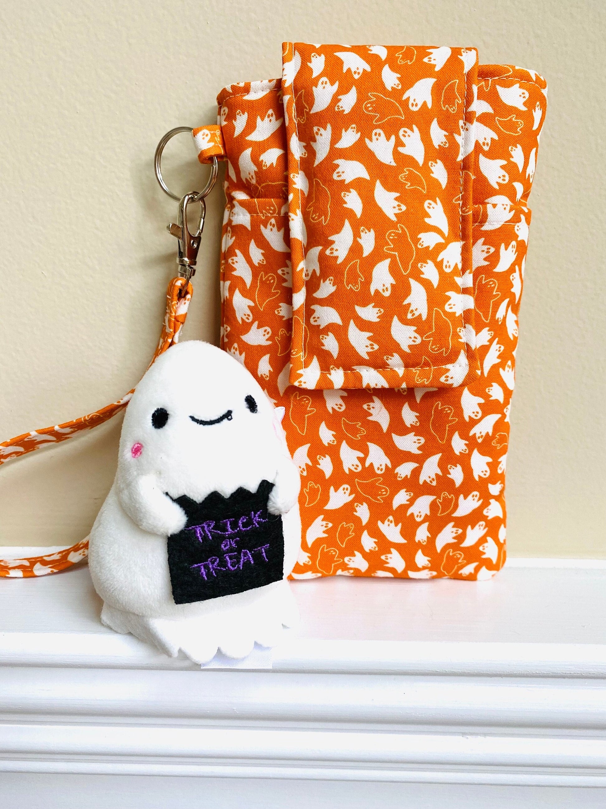 Ghosts Phone Wristlet: Halloween Smartphone Holder with Key Ring, Fits iPhone 16, Phones up to 6.5", Pocket